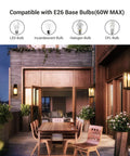 Dope Outdoor Wall Light Fixture With Clear Glass Shade, Matte Black Exterior Sconce illuminating a patio on a summer evening