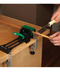 Rock Solid 6 Inch Quick Action Bench Vise With 300 Pound Clamping Power Easy Clamp Mount Non Marring Rubber Jaws V Notch For Round Stock Quick Release Handle Knockout Shop Essential holding a wooden rod during cutting.