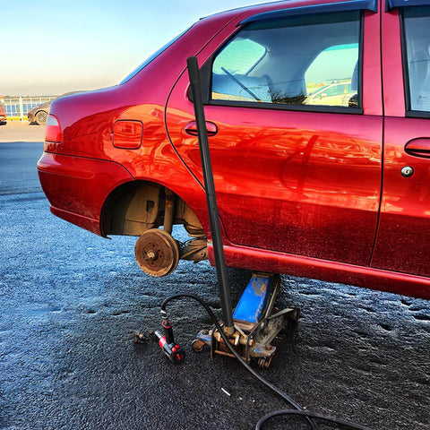 3 Ton Jack Handle Replacement For Horizontal Hydraulic Jack Heavy Duty Carbon Steel Build With Non Slip Grip next to car
