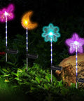 Solar Garden Stake Lights 4 Pack With RGB Color Changing LEDs displayed in garden setting, showing vibrant color modes and solar panels