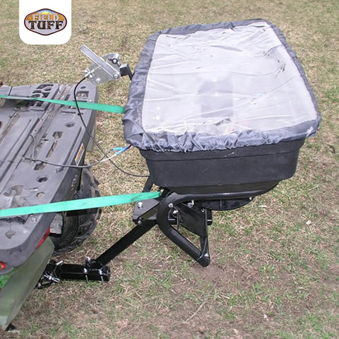 Hitch Mount Grass Seed Spreader With Rain Protector For ATV UTV Or Utility Tractor 12 Foot Broadcast Width 12 Volt Electric Spreader Built Beefy For Lawn And Garden Fertilizer And Seed Application attached to utility vehicle