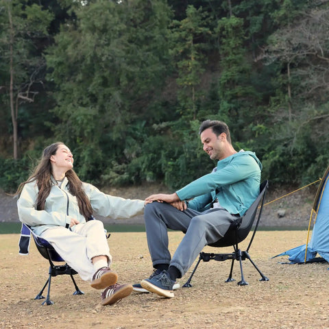 Couple enjoying outdoors sitting on Ultralight Backpacking Chair For Adults With Pouch, Folding Camping Chair Weighs 2.8 Lbs