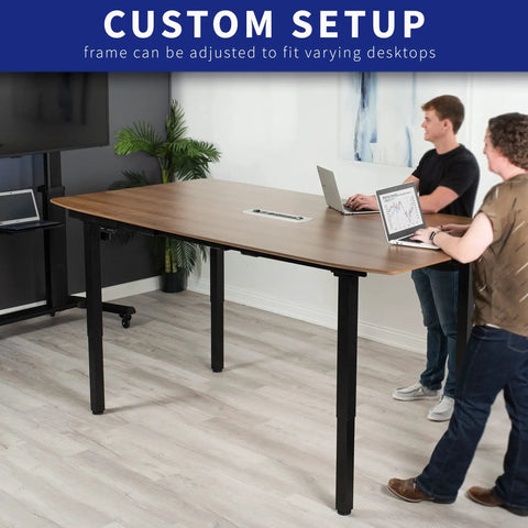 Heavy Duty VIVO 4 Leg Black Electric Dual Motor Standing Desk Frame For 60-130 Inch Tops, Solid height adjustable desk setup with users.