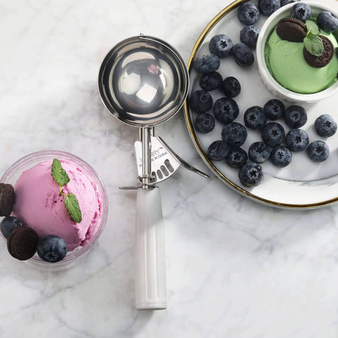 Thumb-Press Food Disher Ice Cream Scoop 4.67 Oz Size 6 White, 18/8 Stainless Steel, near bowls of ice cream and blueberries