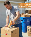Man using Automatic Electric Scissors For Fabric And Carpet Cutting Rechargeable Cordless Power Craft Tool to cut cardboard boxes.
