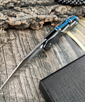 Open Folding Pocket Knife With D2 Steel Blade And Lightweight T6 Aluminum Alloy Handle on wooden surface