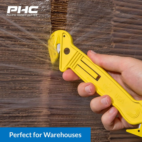 Heavy Duty Dual Head Concealed Safety Cutter Hits Different For Slicing Shrink Wrap Film Cardboard And Plastic Straps With Recessed Blades For Zero Slip Protection And No Sweat All Day Long, cutting through plastic wrap.