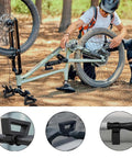 Man using Rugged Bike Repair Stand With Handlebar Stabilizer For Mountain And Road Bikes, Quick Release Clamp at outdoor setup.