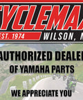 Authorized dealer Cyclemax sign with winding road and cyclists, located in Wilson, NC, established 1974, Yamaha parts emphasized.
