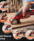 Katerk 4.4V Cordless Electric Scissors & Cardboard Cutter With 2pcs Blades used for cutting cardboard, fabric, leather, and paper.