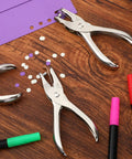 24 Pack Single Hole Punch One Quarter Inch Handheld Paper Punch For Circle Holes Metal Construction on desk with punched paper