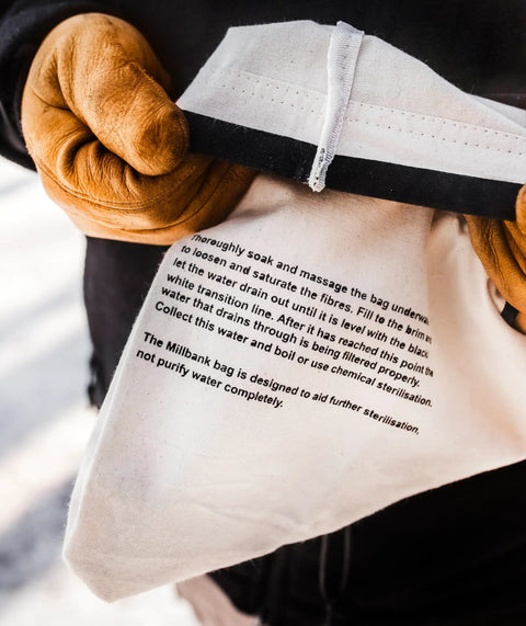 Hands holding Water Filtration Bag For Bushcraft And Military Use, Second Edition With Taped Seams And Double Overlock Stitching