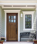 Outdoor Wall Light Sconce Set Two Pack Exterior White Modern Cylinder Style With Tempered Glass Cover Weatherproof Aluminum Housing Ideal For Porch Front Door Garage And Patio Lighting No Fuss Install on a house wall next to a wooden front door.