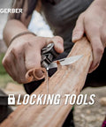 Truss 17 In 1 EDC Pliers Multi Tool With Knife being used to shave wood outdoors