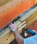 Installation of 80 Piece Stainless Steel Flat Plate Brackets on wood, securing joints for stability and flush mounting.