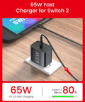 65W GaN3 AC Power Adapter Charger With 6.6 Ft Cable For Nintendo Switch Series OLED Lite Steam Deck OLED ROG Ally 4K TV Mode PD3.0 Game-Ready No-Fuss Fast Charge For PS4 Controller And Galaxy, black USB-C charger on desk