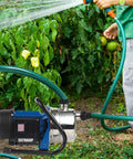 Person using Stainless Steel Portable Water Pump For Your Yard Sprinklers And Garden Irrigation Bang For Your Buck 1HP 115V 60Hz