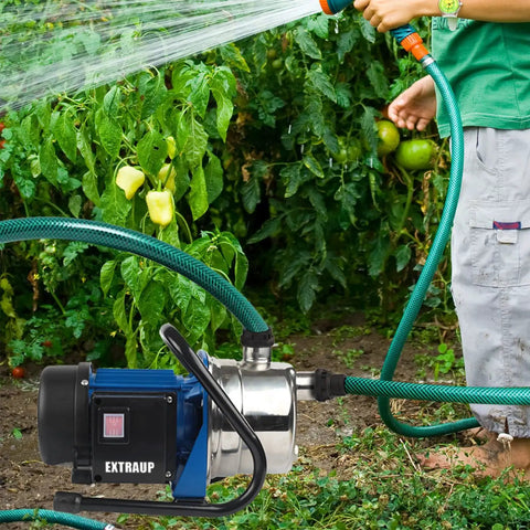 Person using Stainless Steel Portable Water Pump For Your Yard Sprinklers And Garden Irrigation Bang For Your Buck 1HP 115V 60Hz
