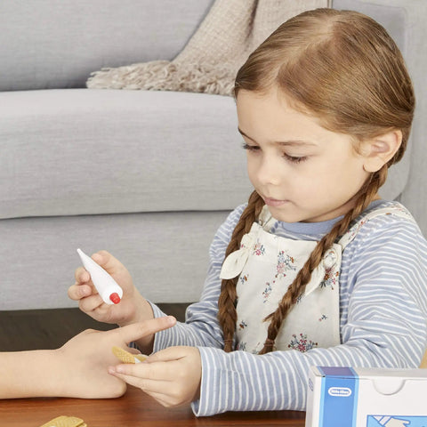 Child using Realistic Kids First Aid Kit For Pretend Doctor Play With 25 Accessories Including Gauze Pads And Bandages