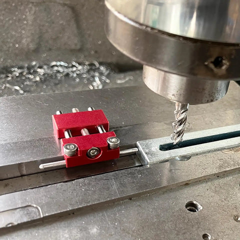 Precision Adjustable Vise Work Stop And Quick Clamp Jaw Featuring Hella Tough Red Anodized Aluminum Build on a milling machine.