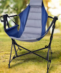 Hammock Camping Chair With 3 Height Settings And Headrest Portable Adjustable Backrest Padded Seat Cup Holder in a grassy field