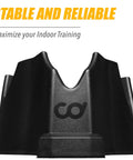 Front Wheel Riser Block For Indoor Bike Trainers With Three Height Levels, black, shown from front angle with logo visible.