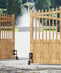 4 Inch Gate Wheels With Spring Loaded Caster And 360 Degree Universal Mount Plate For Wooden Fence And Metal Gates Heavy Duty 220 Lb Capacity Black Absorbs Vibration And Handles Uneven Surfaces Across Concrete Dirt And Grass shown installed on wooden gates