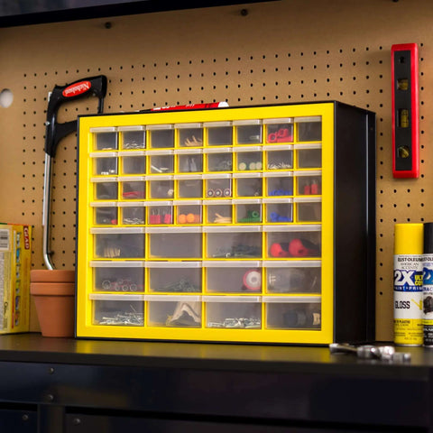 Totally Rad Plastic Hardware Organizer With Forty Four Drawers Badass Tool Storage For Screws Nuts Bolts And Crafts Yellow wall-mounted box with multiple clear drawers.