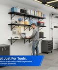 Two Pack 1x6ft Perforated Garage Shelving System With Beefy Duty Wall Shelves 1400 Lbs Total Load 700 Lbs Per Tier Two 1x3 Ft Shelves Per Tier Easy Mount Great For Quick No Nonsense Garage Organization in garage with man using laptop