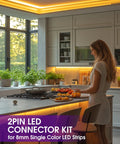 Woman installs No-Solder No-Fuss Gapless LED Connector Kit for 8mm 2835 and 3528 LED strips in modern kitchen lighting.
