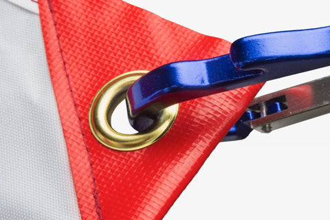 Close-up of grommet and clip on Dive Flag With Removable Stiffening Pole 20x24 Inches For Scuba, Spearfishing, And Freediving - US Legal Diver Down Flag