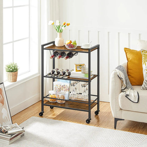 Slick 3 Tier Rolling Bar Cart With Ultra Smooth Swivel Wheels Rustic Brown Finish showing bottles, snacks, and glassware in living room.