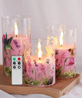 Pink Hummingbird Floral Glass Flameless Candles With Remote Timer Flickering Battery LED Pillar Candles Set Of 3 on wood tray