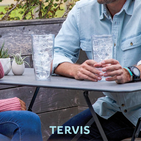 Two people at a table with Washington Commanders 24oz Double Wall Insulated Tumbler Cup Keeps Drinks Cold Or Hot All Day BPA Free