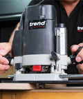 Hands adjusting the Multifunction Combination Router Base With Quick Change Design And Offset Baseplate for precision work.