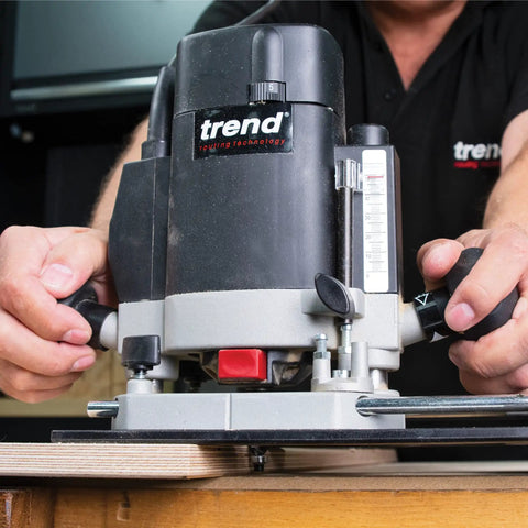 Hands adjusting the Multifunction Combination Router Base With Quick Change Design And Offset Baseplate for precision work.