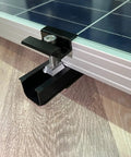 Close-up of Solar Panel Mounting Brackets Roof Kit With Rails And Clamps For 1.18 To 1.38 Inch Panel Thickness A Row Roof Assembly
