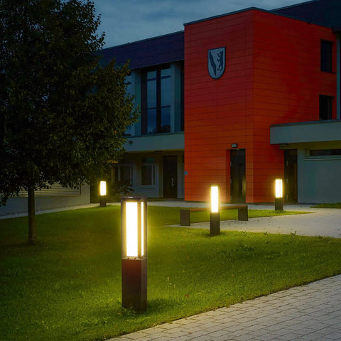 Landscape Path Light 32 Inch Outdoor Bollard Aluminum 8W 800LM LED Lighting For Lawn Patio Courtyard Driveway And Garden Weatherproof Frosted Finish Wired 100 240V Residential Outdoor Lighting illuminating a pathway at night.