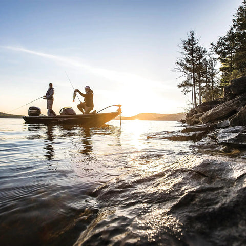 Boaters on a lake near rocks using EPA And CARB Certified 3 Gallon Portable Marine Boat Fuel Tank With Automotive Grade Multi Layer Construction Automatic Vacuum Valve For Consistent Fuel Flow