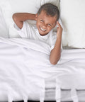 Child smiling under DNA Gel Black And White Throw Blanket Plush Fleece 60 By 50 Inches Super Soft Cozy Warm 100 Percent Polyester