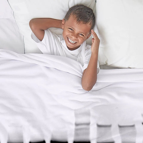Child smiling under DNA Gel Black And White Throw Blanket Plush Fleece 60 By 50 Inches Super Soft Cozy Warm 100 Percent Polyester