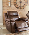 Heavy Duty 29V 2A Power Supply Adapter For Recliner And Lift Chair plugged into brown recliner with relaxed footrest.