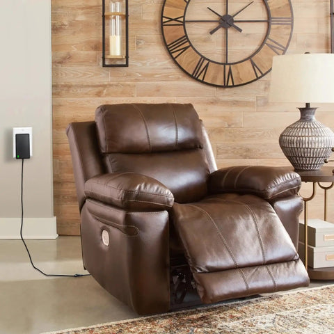 Heavy Duty 29V 2A Power Supply Adapter For Recliner And Lift Chair plugged into brown recliner with relaxed footrest.