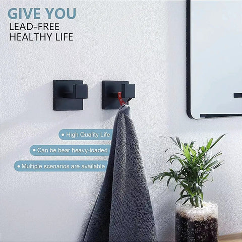 Bathroom view showcasing two matte black square towel hooks with a towel hanging. Six Pack Square Towel Hooks In Matte Black.