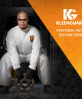 Person wearing A40 Liquid And Particle Protection Coveralls With Zipper Front White Large, holding equipment, KleenGuard logo