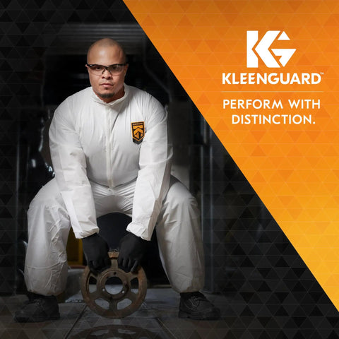 Person wearing A40 Liquid And Particle Protection Coveralls With Zipper Front White Large, holding equipment, KleenGuard logo
