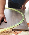 Nail Smooth Curves In Your Woodworking Projects With This Flexible Curve Router Guide Built Tough From Polyurethane And Equipped With Durable Brass Bushings Two Meters Long in use on a wood surface.