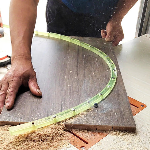 Nail Smooth Curves In Your Woodworking Projects With This Flexible Curve Router Guide Built Tough From Polyurethane And Equipped With Durable Brass Bushings Two Meters Long in use on a wood surface.