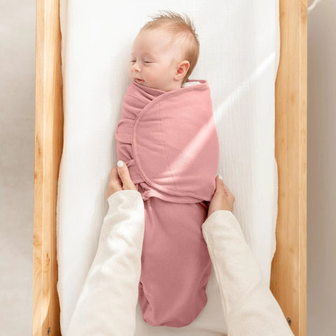 Parent holding baby in Cozy Baby Swaddle Blanket Set Three Pack 100 Percent Cotton Newborn Wraps For 0 To 3 Months in mauve color