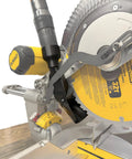 Enhanced Dust Collection Port For DWS779 And DWS780 Miter Saws installed, showing adapters for various hose sizes in a woodworking setup.
